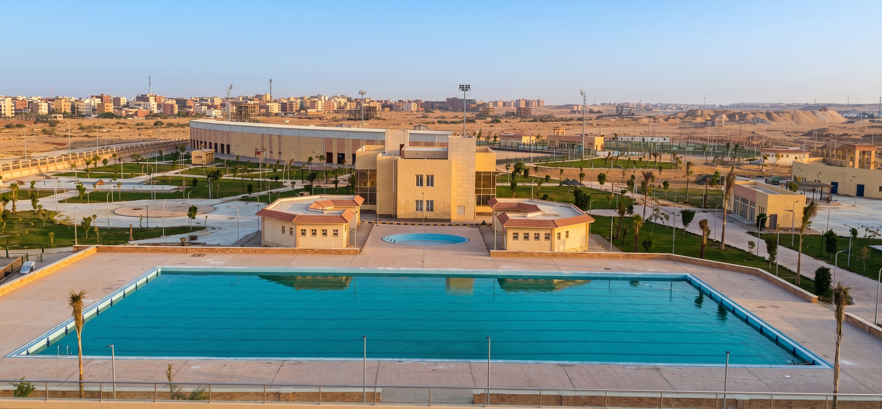 لمحة من مرافق نادي التنمية بمدينة بدر — مسابح ومساحات خضراء